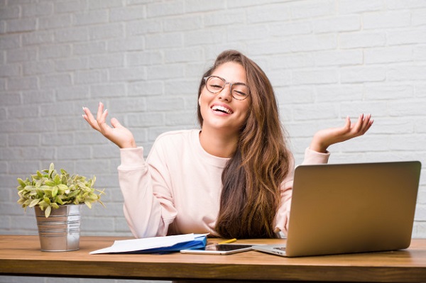 portrait-young-student-latin-woman-sitting-her-desk-laughing-having-fun_1187-15401.jpg